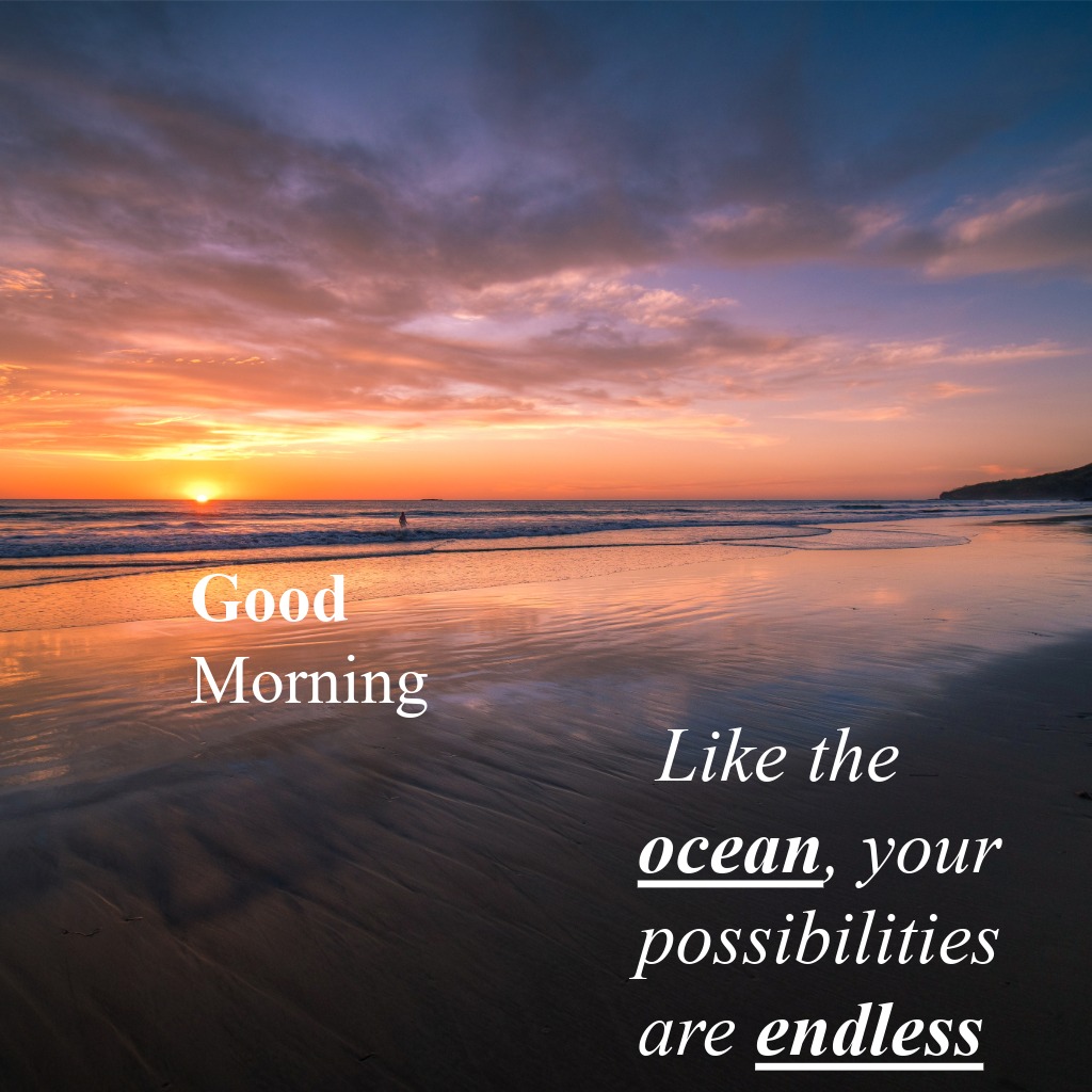Waves meeting the shore beneath a vibrant sunrise